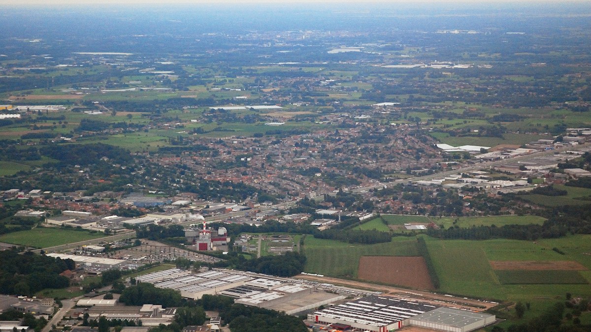 Aerial photograph of the village of Aartselaar in the province of Antwerp, Belgium. In the centre of the background the city of Mechelen can be distinguished. Nikon D60 f=55mm f/5.6 at 1/640s ISO 800. Contrast and colours enhanced using Nikon NX Studio 1.
