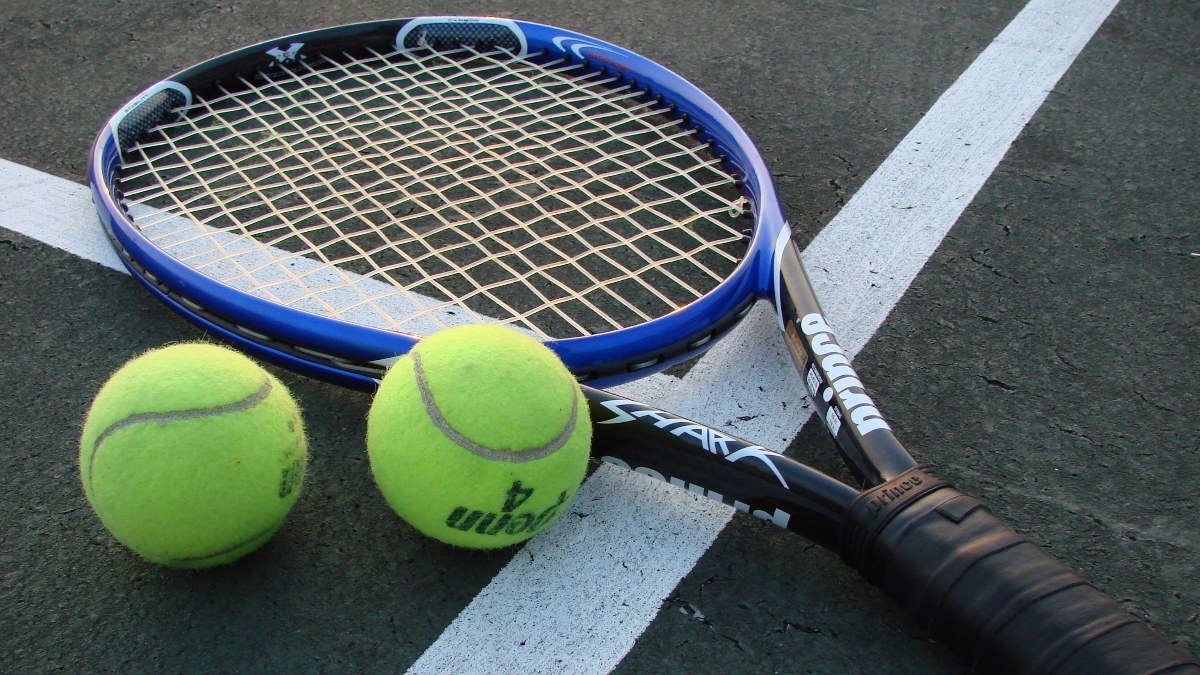 Shot of a tennis racket and two tennis balls on a court. Taken by myself of my racket. Intended for use in WikiProject Tennis Template. vlad§inger tlk 04:59, 18 June 2007 (UTC)